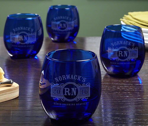 Marquee Cobalt Wine Glass Set | Food For Net Set of four blue wine glasses on a wooden table
