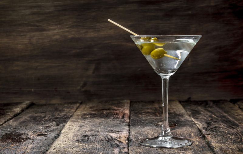 A vodka martini with olives as a garnish