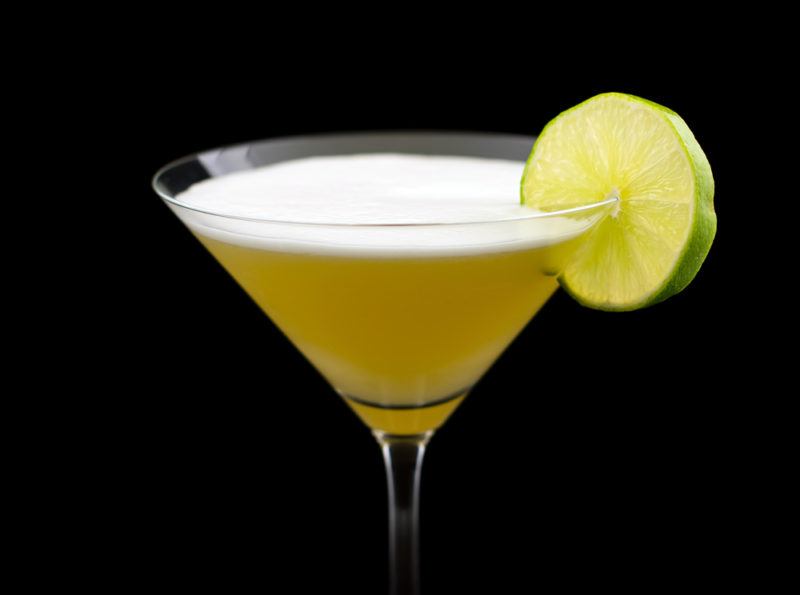 A yellow Matador cocktail against a black background