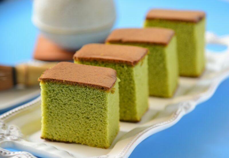 Four matcha castella cakes on a white plate