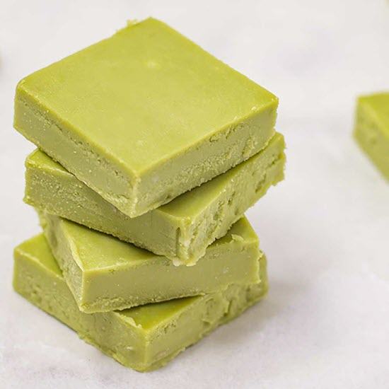 A stack of lime green keto fudge