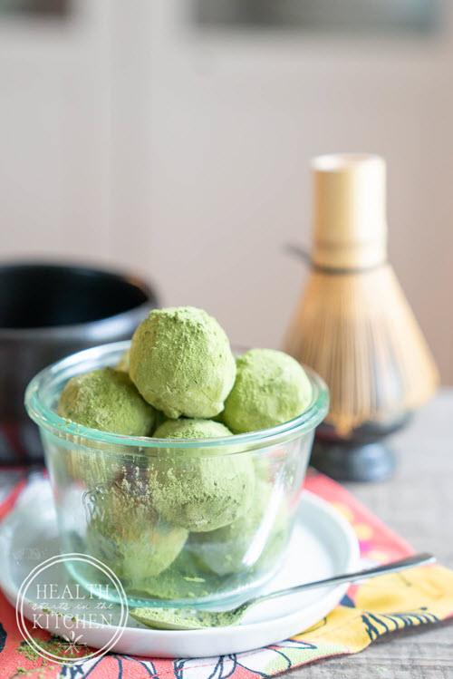 A glass bowl of matcha truffles