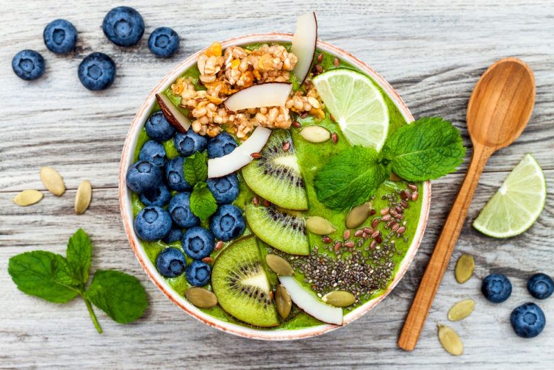 A white protein bowl that contains a matcha smoothie