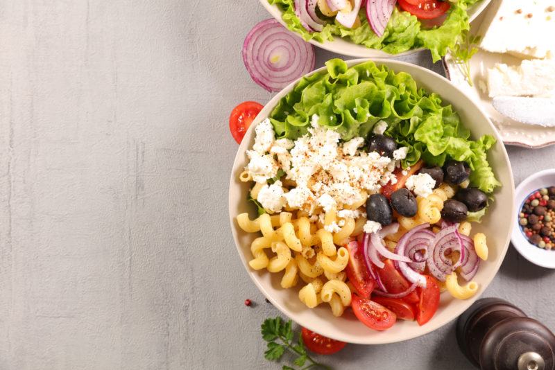 A white bowl with Mediterranean ingredients