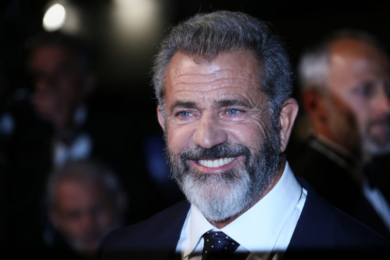 Mel Gibson wearing a suit at an awards ceremony