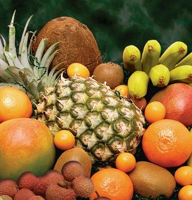 Various fruits, including a pineapple, coconut and bananas