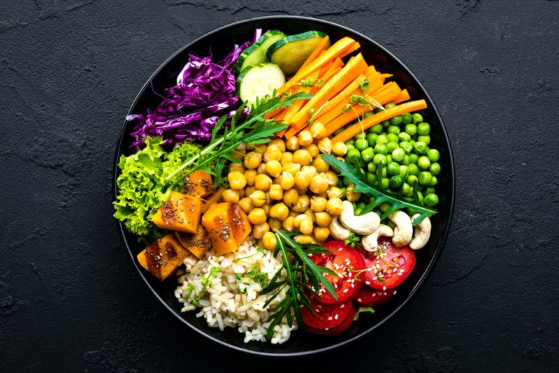 A black bowl with MMiddle Eastern ingredients