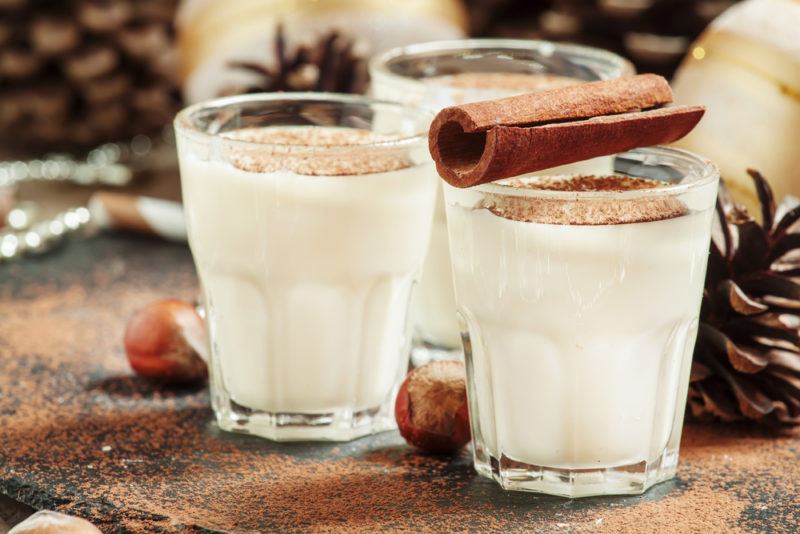 Three glasses of a seasonal cocktail made with milk and honey