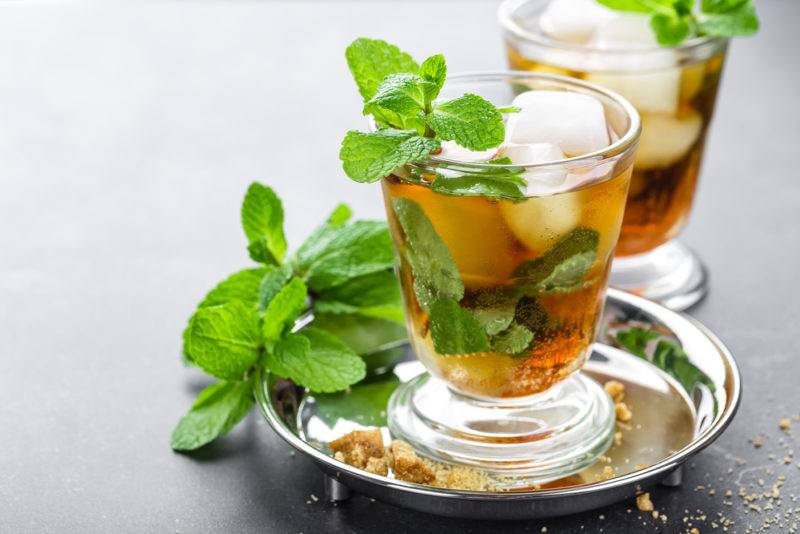 Two mugs of mint julep cocktail