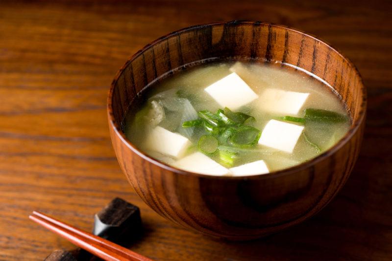 A brown bowl of miso soup