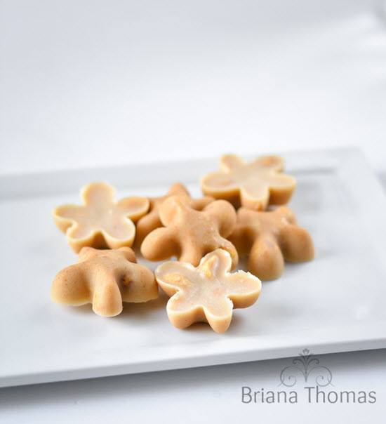 Flower shaped fat bombs on a white plate