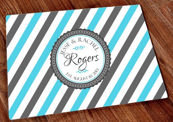 Monogram-Stamp-Cutting-Board | Food For Net Glass cutting board with blue and gray diagonal lines.