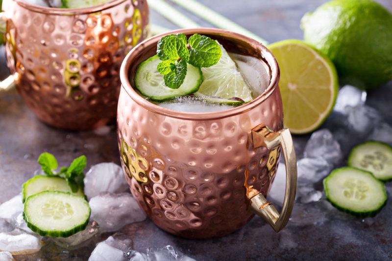 Two copper mugs with Moscow mule cocktails