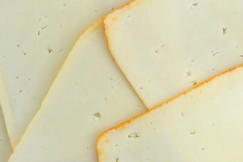 Slices of Munster cheese spread out