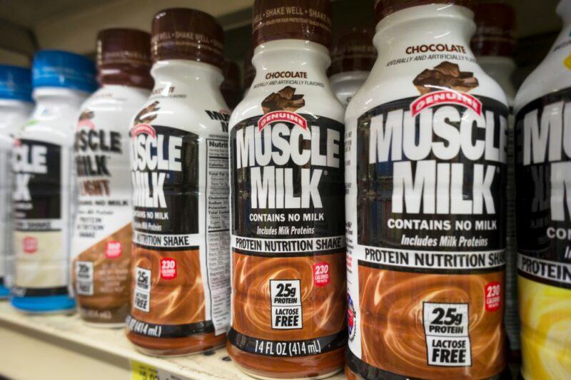 Bottles of Muscle Milk protein shakes on a grocery store shelf