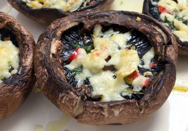 Cooked portabello mushrooms with cheese