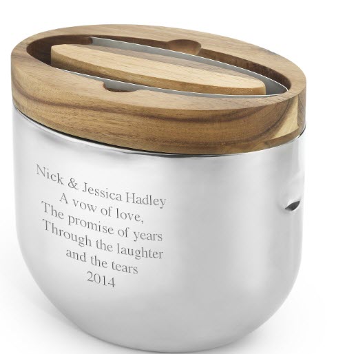 Nambe Mikko Ice Bucket | Food For Net A stainless steel ice bucket with a wooden lid and tongs
