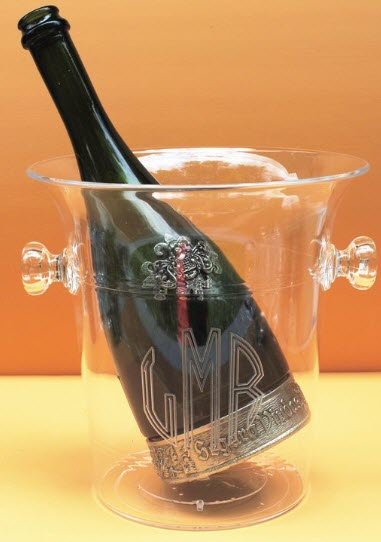 Name Or Monogram Champagne Bucket | Food For Net A clear bucket with a bottle of wine.