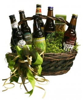 Green-themed gift basket with beer and snacks.