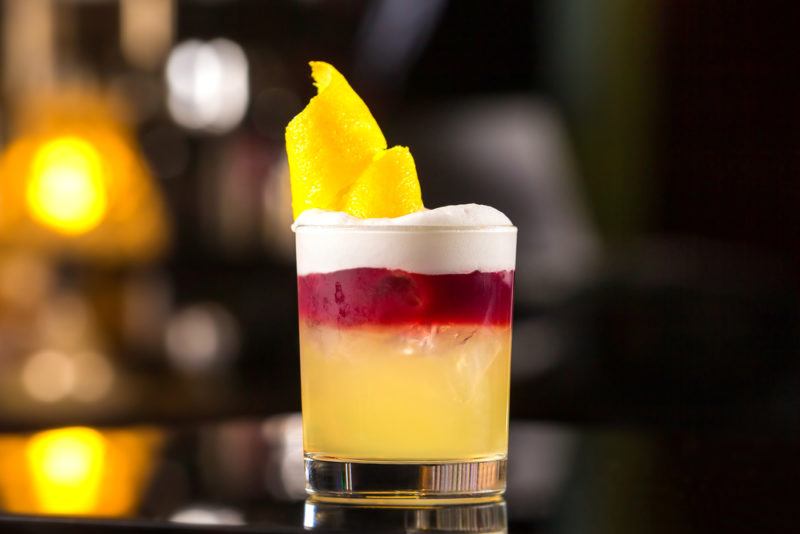 A New York sour cocktail on a bar, with the seperation of layers clearly visible