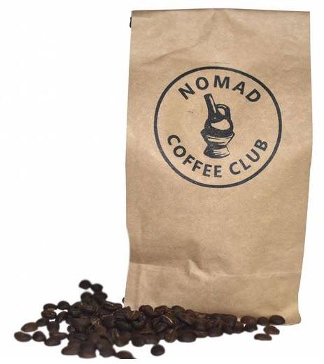 A brown bag of coffee with coffee beans