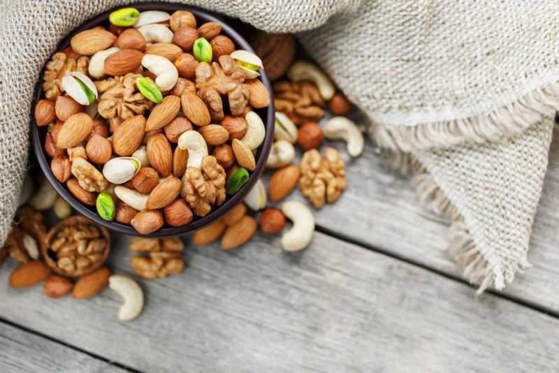 A bowl containing various types of nuts