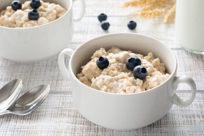 Oatmeal with blueberries in a white container