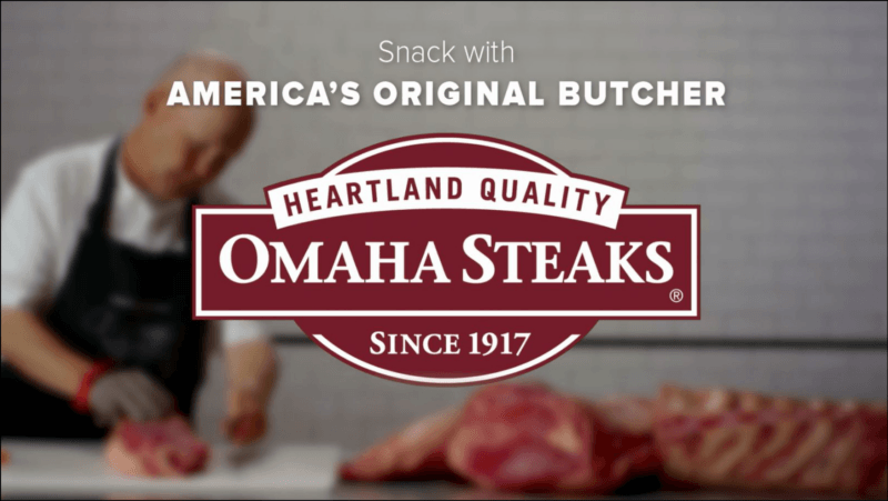 screenshot of Ohama Steaks Gift Boxes' web page, the website's name and logo with a background of a butcher at work