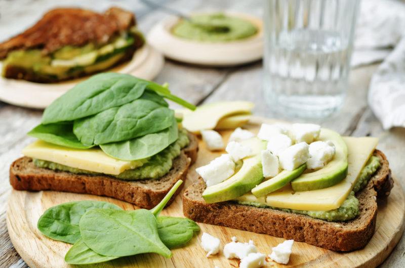 Open face sandwich with spinach and avocado