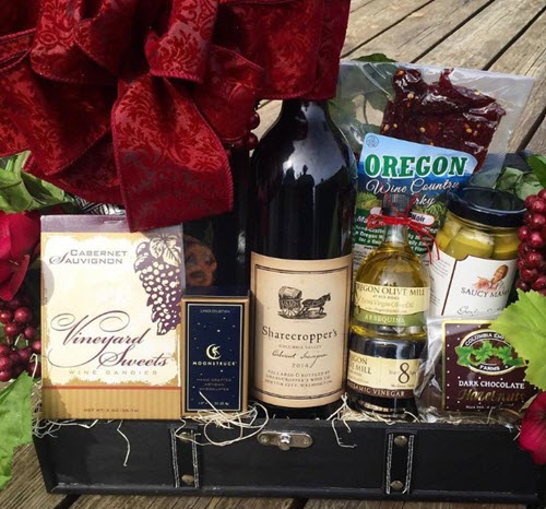 Oregon Wine Country Gift Basket | Food For Net A trunk with various sweets and wine.