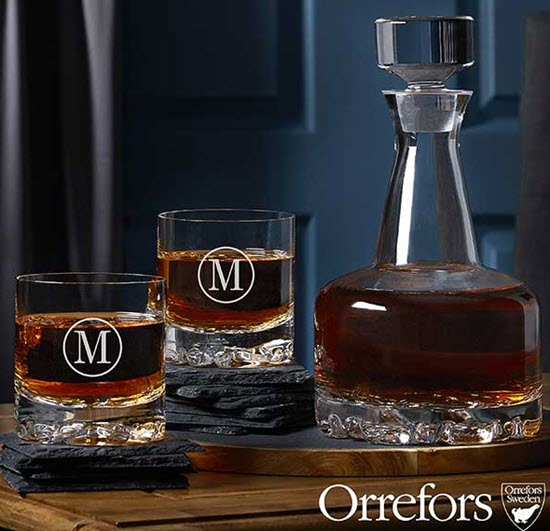 Orrefors Engraved Whiskey Decanter Set | Food For Net A whiskey decanter and glasses on various slate coasters