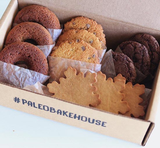 A cardboard box with 12 baked paleo items