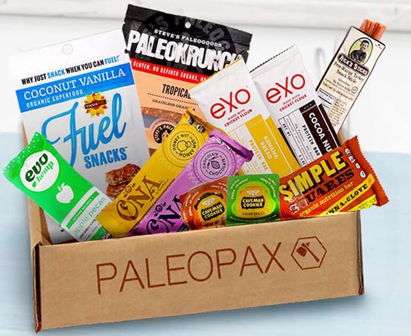 A cardboard box with various paleo snacks