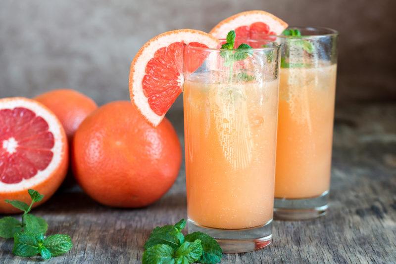 Two paloma cocktails with grapefruits