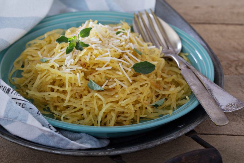 A bowl of pasta that has been made from spagheti squash