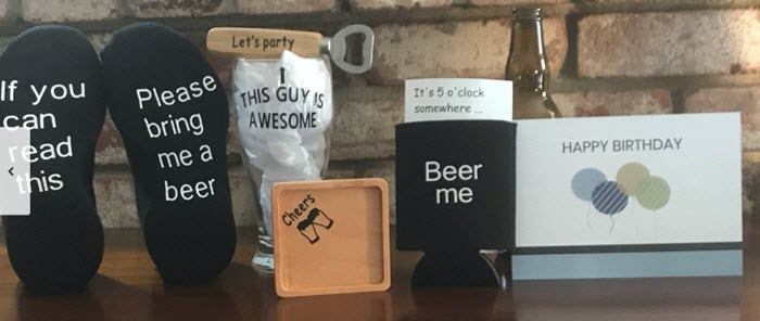 Selection of beer-related products, including socks, a coaster and a bottle opener.