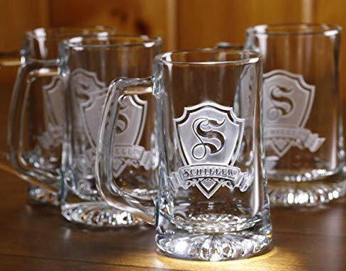 Collection of four glass monogrammed beer mugs