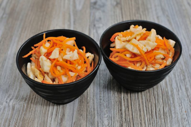 Two black bowls of picked vegetables