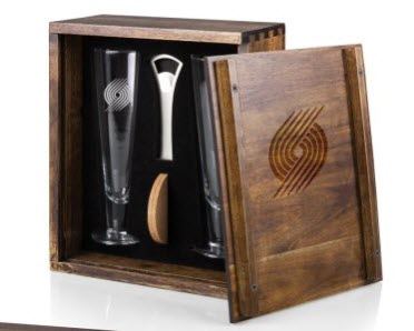 An open box containing two glasses, a bottle opener and coasters. 