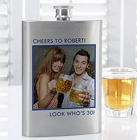 Picture Perfect Personalized Photo Flask | Food For Net Stainless steel flask with a photo printed onto it next to a shot glass.