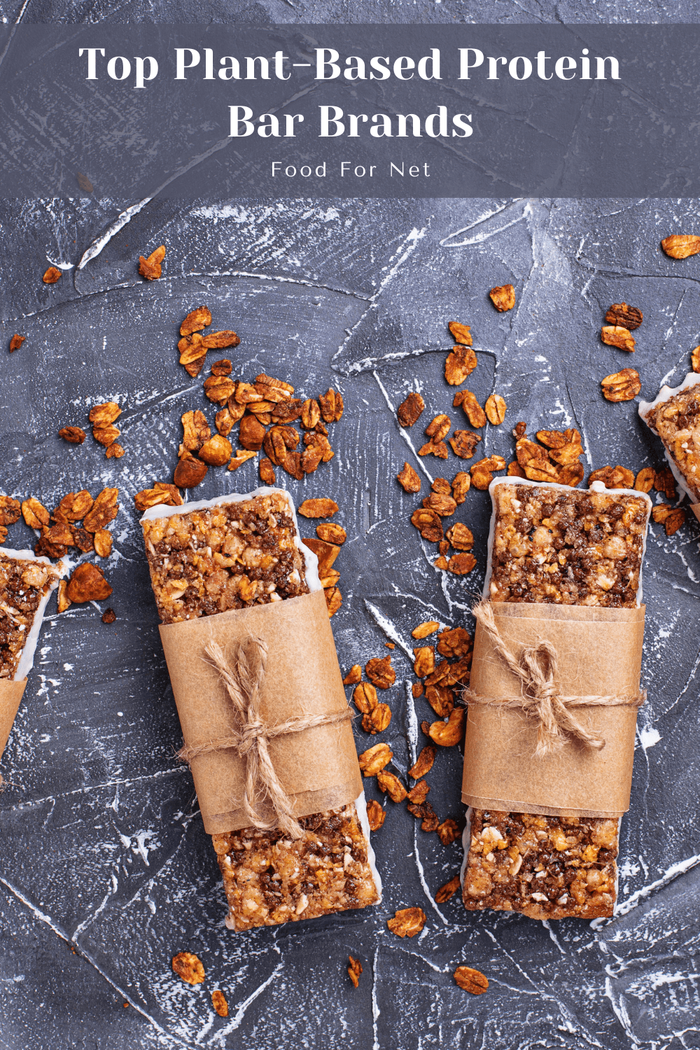 Four plant-based protein bars on a gray table, showing the idea of the best brands