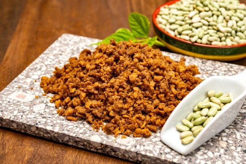 A marble tray containing some plant-based meat designed to behave like ground beef