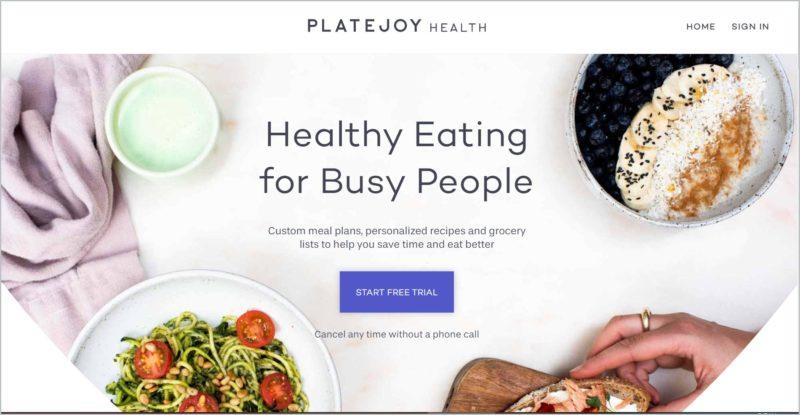 screenshot of PlateJoy homepage with an image of plated meals and a partial hand holding a crostini