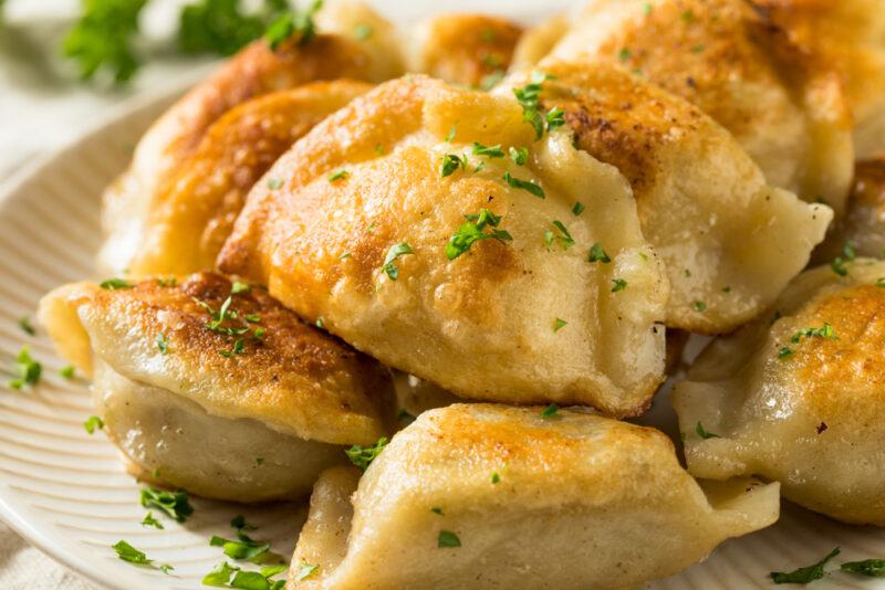 A white dish containing Polish pierogi