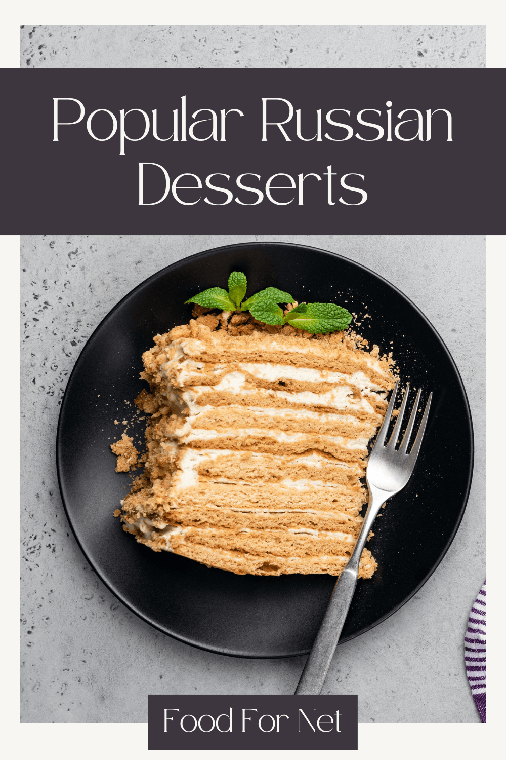 A black plate with a layered Russian dessert, highlighting just how many delicious Russian desserts there are