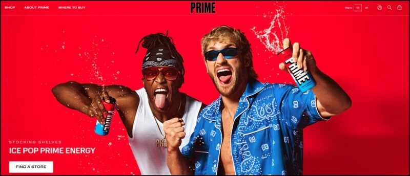 Two excited men with Prime Energy drinks against a red background