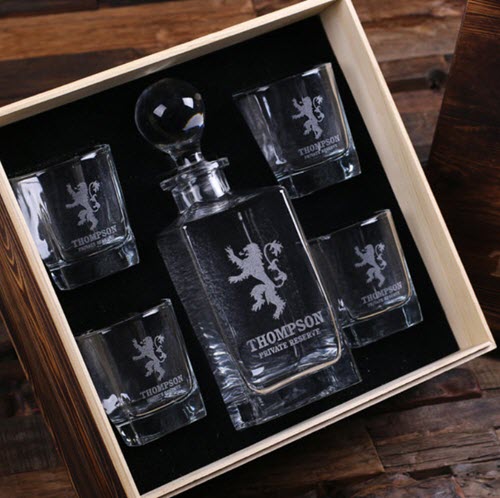 Private Reserve Whiskey Decanter Set | Food For Net A whiskey decanter and four glasses in a wooden box engraved with a lion