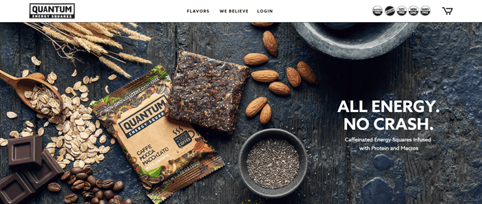 The website for Quantum Energy Squares shows an image of the Caffe Mocca Macciato Bar as well as a closed packet. There are also variou ingredients that go into the bar in the image, including oats, chocolate, almonds and coffee.