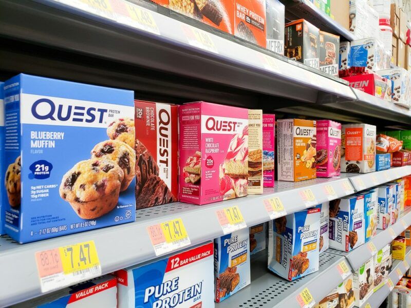 Boxes of Quest bars and other products in a grocery store