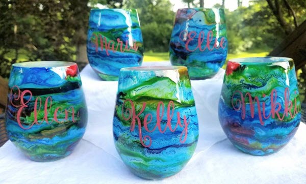 Rainbow Swirl Wine Glass Set | Food For Net Set of 5 rainbow swirled glasses with red text
